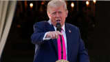 U.S. President Donald Trump gestures, as he speaks from a balcony, on the day he is expected to sign a sweeping spending and tax legislation, known as the "One Big Beautiful Bill Act," at the White House in Washington, D.C., U.S., July 4, 2025. 