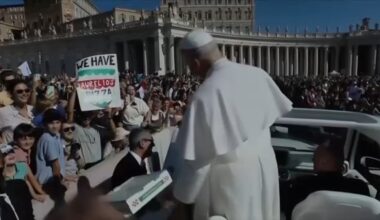 Pope Leo gets pizza delivered from Chicago while riding through Saint Peter's Square in Vatican City