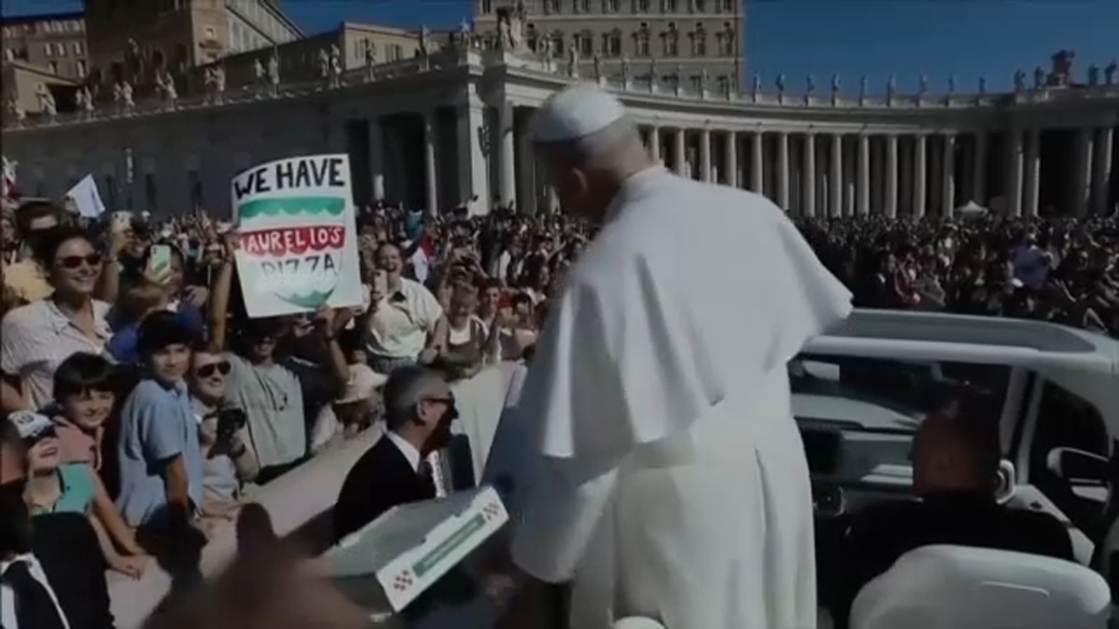 Pope Leo gets pizza delivered from Chicago while riding through Saint Peter's Square in Vatican City