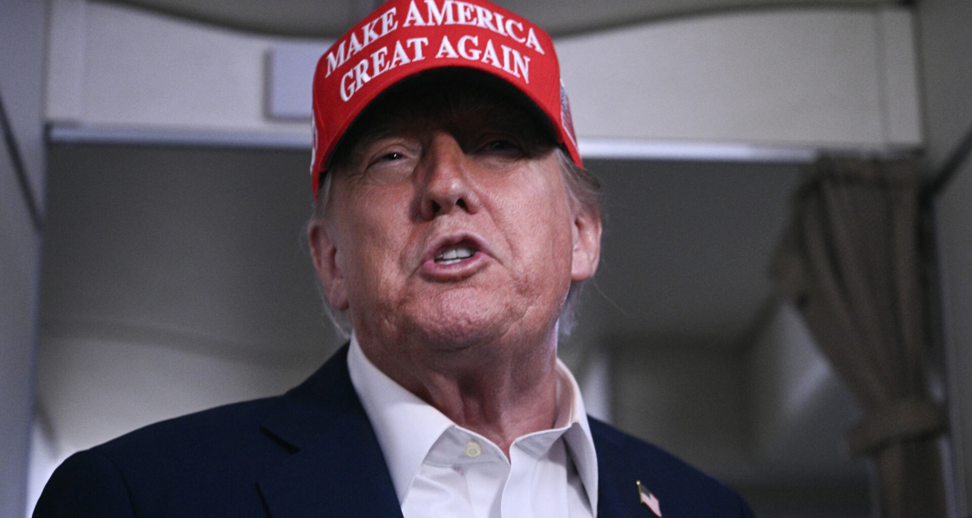 President Donald Trump speaks to journalists