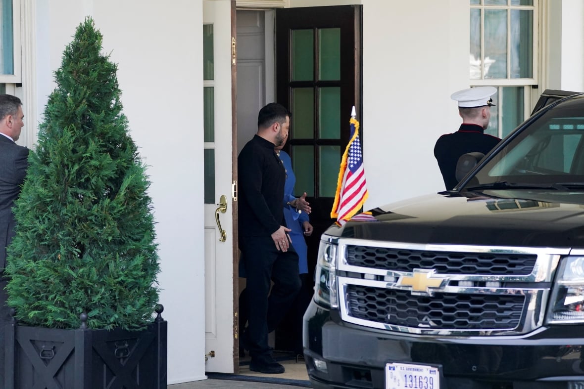 A man in formal black clothing leaves the White House and gets into a black SUV.