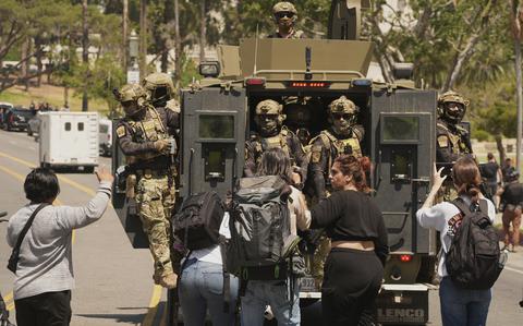 National Guard troops with Humvees back federal agents in immigration sweep of LA park