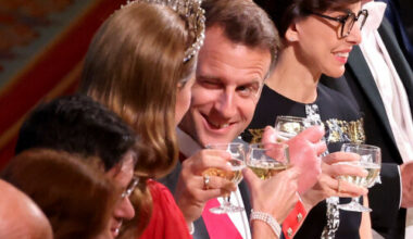French President Emmanuel Macron winks at Catherine, Princess of Wales during banquet