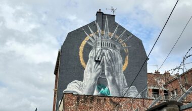 A new mural in France shows the Statue of Liberty covering her eyes in a swipe at Trump