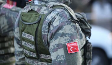 The side of a person in Turkish military fatigues.