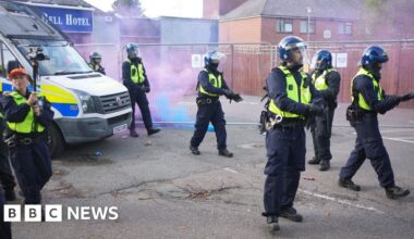 Protesters gather in Epping as bottles and flares are thrown