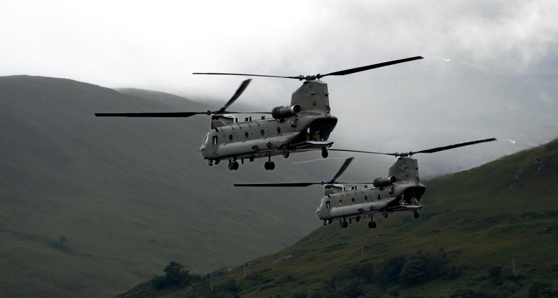 Two Chinook helicopters low pass down Loch Linnhe, Fort William.