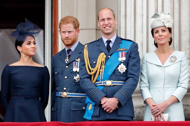 Meghan, Duchess of Sussex, Prince Harry, Duke of Sussex, Prince William, Duke of Cambridge and Catherine, Duchess of Cambridge watch a flypast to mark the centenary of the Royal Air Force from the balcony of Buckingham Palace on July 10, 2018
