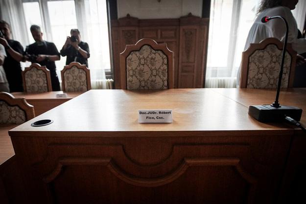 An empty chair reserved for Prime Minister Robert Fico