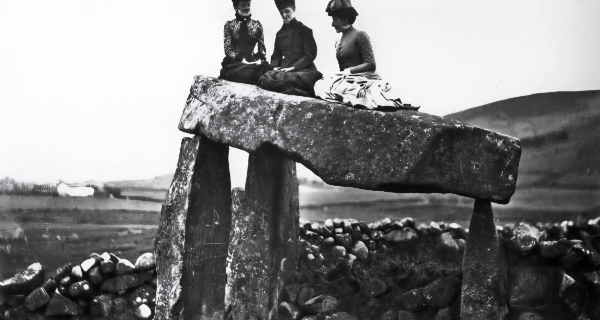 Victoriana Era ladies posing on top of Legananny Dolmen, Castlewellan, 1895