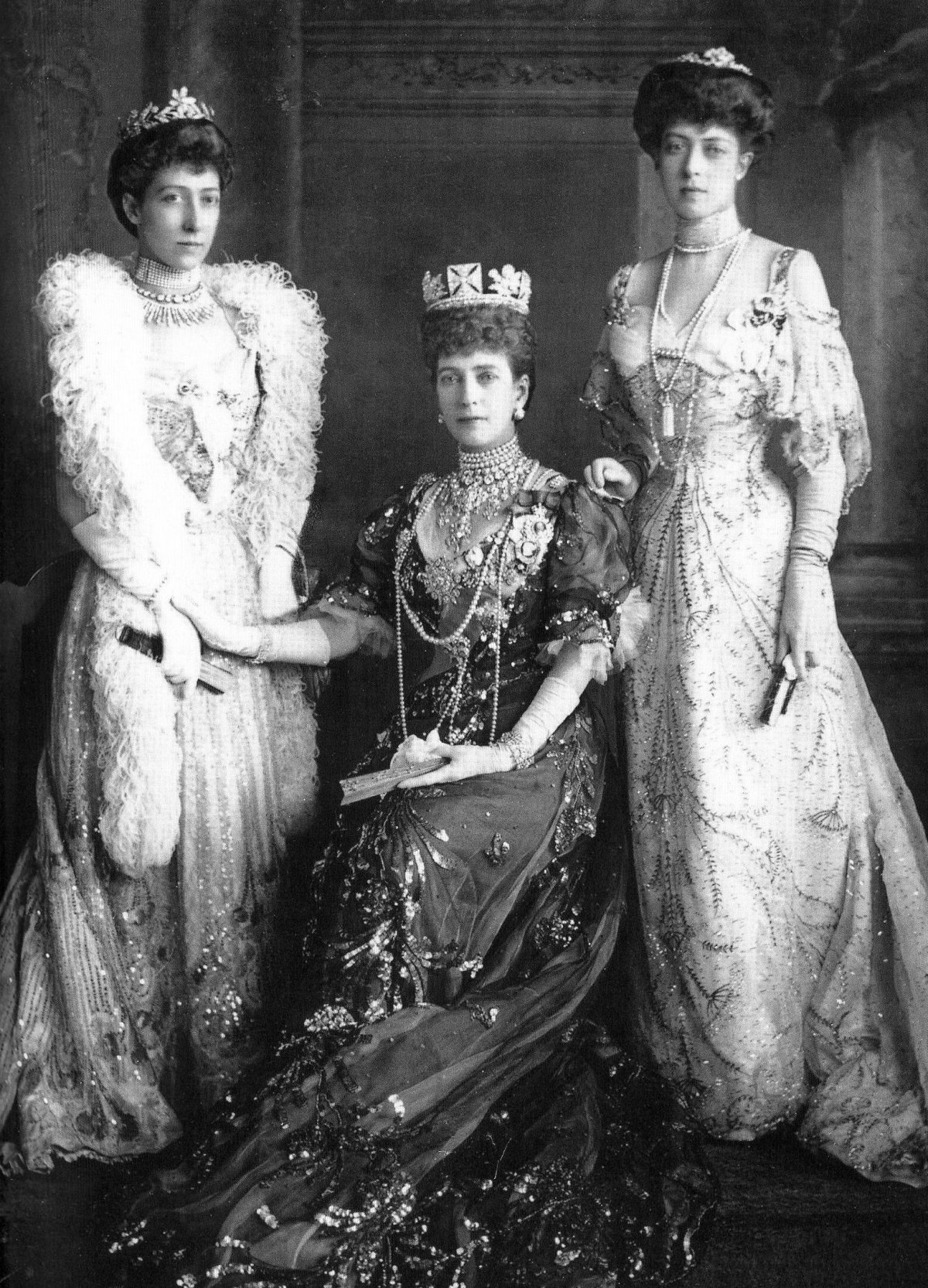 Queen Alexandra poses with Princess Louise and Princess Victoria during the wedding celebrations for Prince Gustaf Adolf of Sweden and Princess Margaret of Connaught in Windsor on June 15, 1905 (Wikimedia Commons)