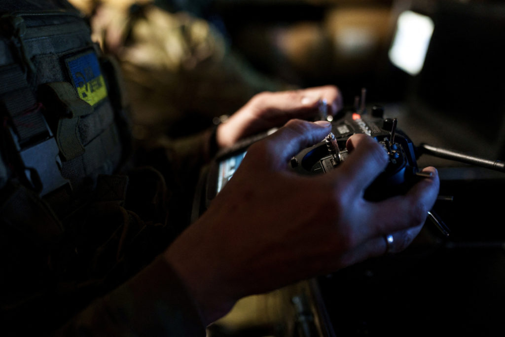 FILE PHOTO: Ukrainian serviceman controls a heavy combat drone while it flies over positions of Russian troops in Donetsk ...