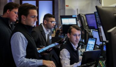 Wall Street edges higher after Trump denies plans to fire Powell