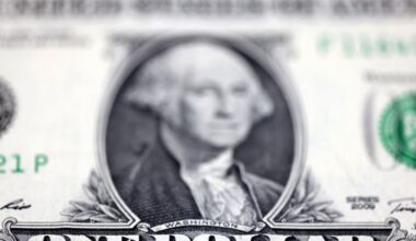 Dollar climbs as traders mull Powell's future, yen dips ahead of Japan election