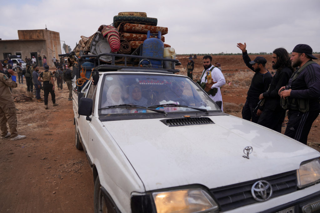 Bedouin families leave the village of Al-Mazraa