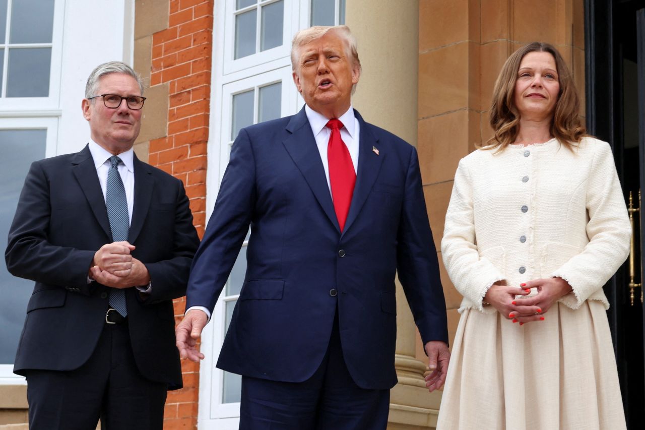 President Donald Trump speaks to the press alongside British Prime Minister Keir Starmer and his wife Victoria Starmer in Turnberry, Scotland, on Monday.