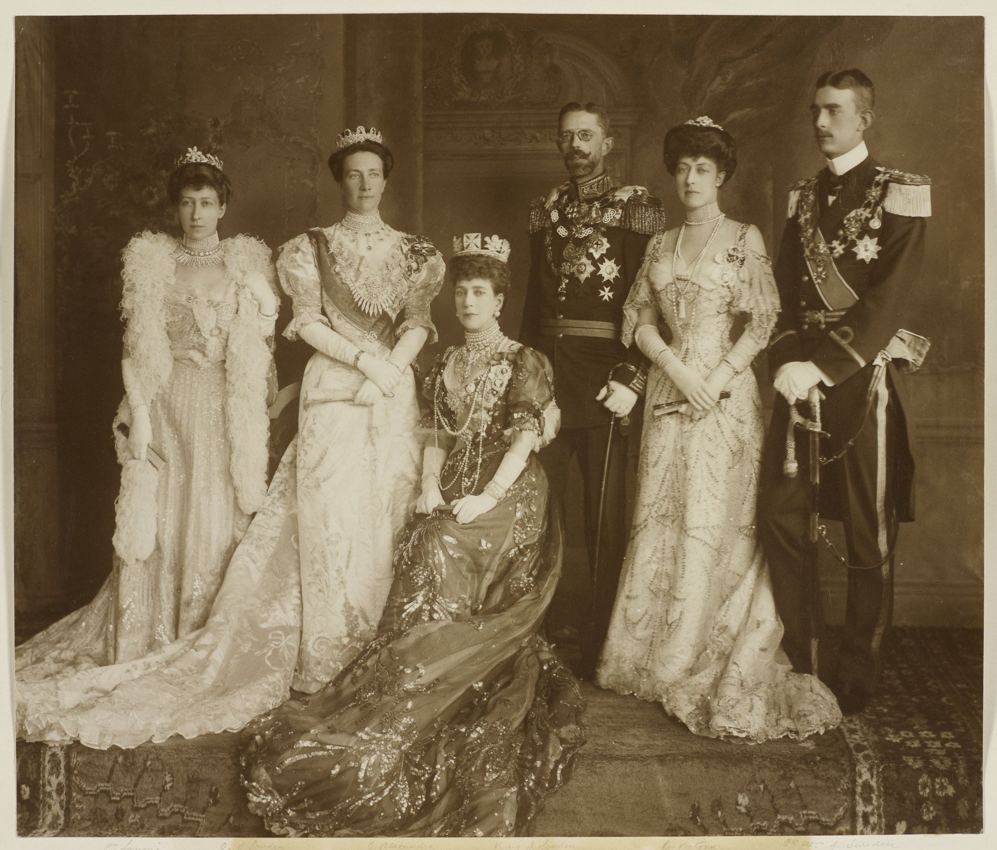 Family group taken during the wedding celebrations in Windsor on June 15, 1905: Princess Louise; Crown Princess Victoria of Sweden; Queen Alexandra; Crown Prince Gustaf of Sweden; Princess Victoria; Prince Wilhelm of Sweden (Royal Collection Trust)