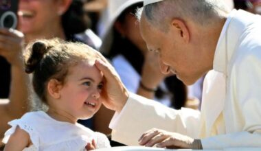 Pope Leo XIV blesses a little girl during the June 25 general audience in St. Peter's Square.