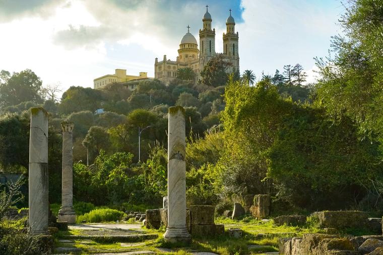 Roman ruins of the ancient city of Hippo with the Church of St. Augustine in the background, Annaba, Algeria