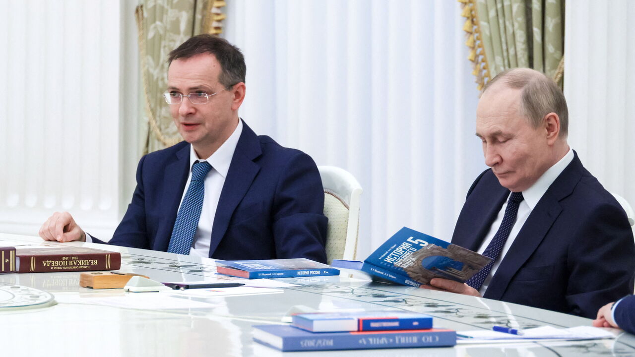 Russian President Vladimir Putin and Presidential Aide Vladimir Medinsky attend a meeting with editors of the federal lineup of history textbooks for grades 5 to 11 of secondary school as well as vocational schools, at the Kremlin in Moscow, Russia.