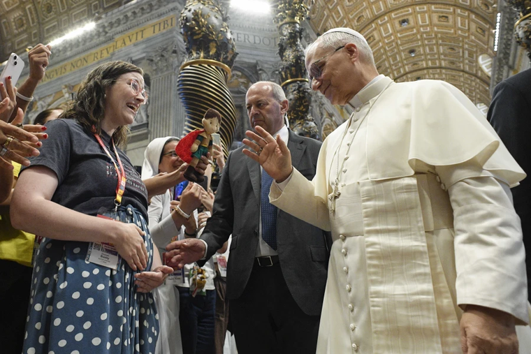 Pope Leo XIV blesses Elizabeth Busby and her baby on the way at the Mass for Digital Missionaries on July 29, 2025, at St. Peter’s Basilica at the Vatican. A family and marriage therapist, Busby hosts the “Discerning Marriage” podcast and developed the Next Step formation program for people who are discerning marriage.
