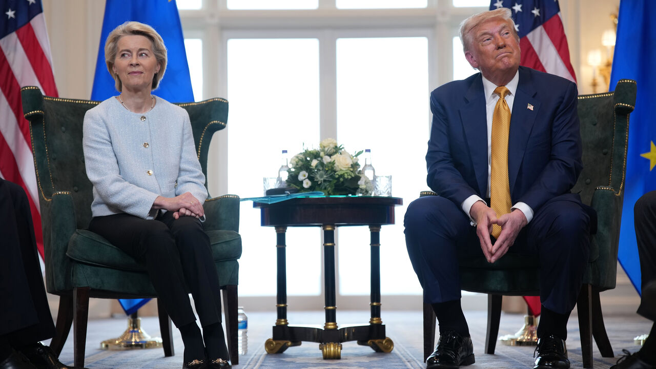 President of the European Commission Ursula von der Leyen meets with U.S. President Donald Trump as they both sit smiling facing look away from each other, at Trump Turnberry golf club in Turnberry, Scotland.