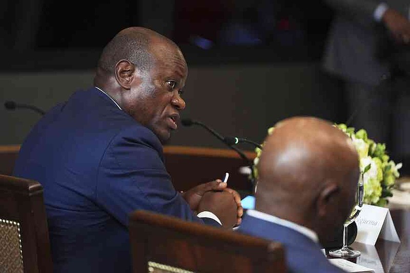 Gabonese President Brice Oligui Nguema speaks to President Donald Trump during a lunch with African leaders in the State Dining Room of the White House, Wednesday, July 9, 2025, in Washington. (AP Photo/Evan Vucci)