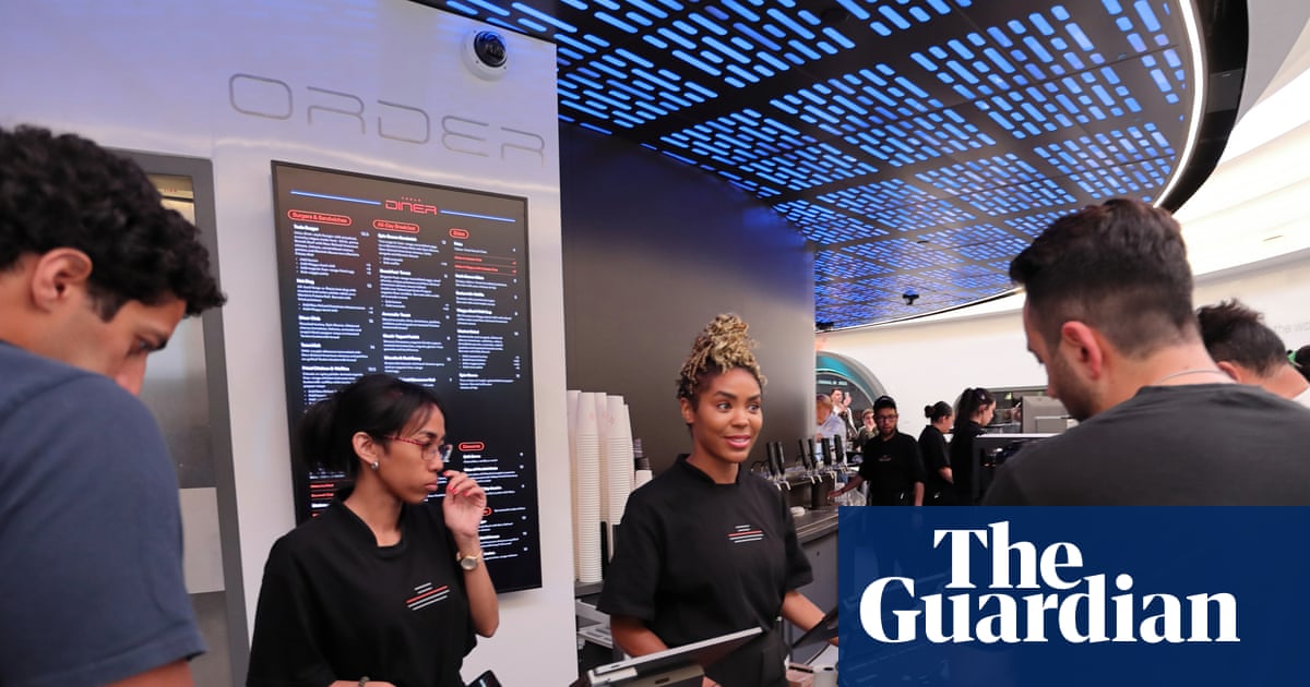 Cybertruck boxes and tacos: Elon Musk opens ‘retro futuristic’ Tesla Diner in LA | US news