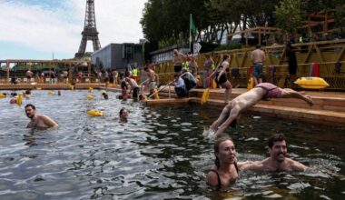 Joyful Parisians take a historic plunge into the Seine after 100 years