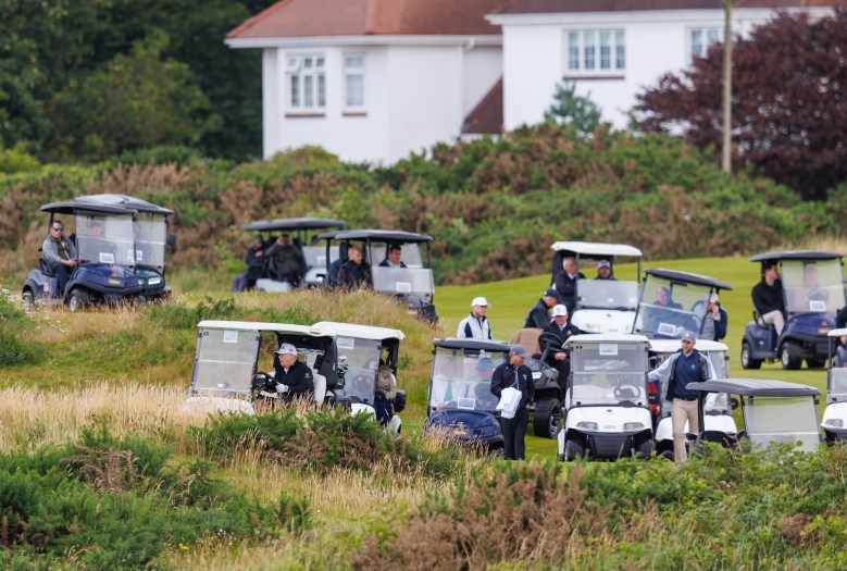 A large security presence follows the US President as he golfed on the famous Turnberry course 