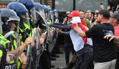 Anti-migrant protesters clash with police outside asylum hotel