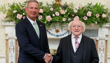 July 1, 2025: US Ambassador to Ireland Edward Walsh (L) shakes hands with President of Ireland Michael D Higgins following a ceremony in Áras an Uachtaráin.