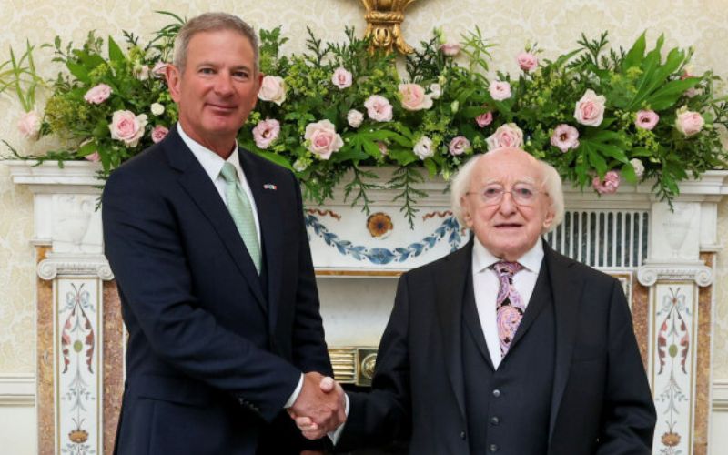 July 1, 2025: US Ambassador to Ireland Edward Walsh (L) shakes hands with President of Ireland Michael D Higgins following a ceremony in Áras an Uachtaráin.