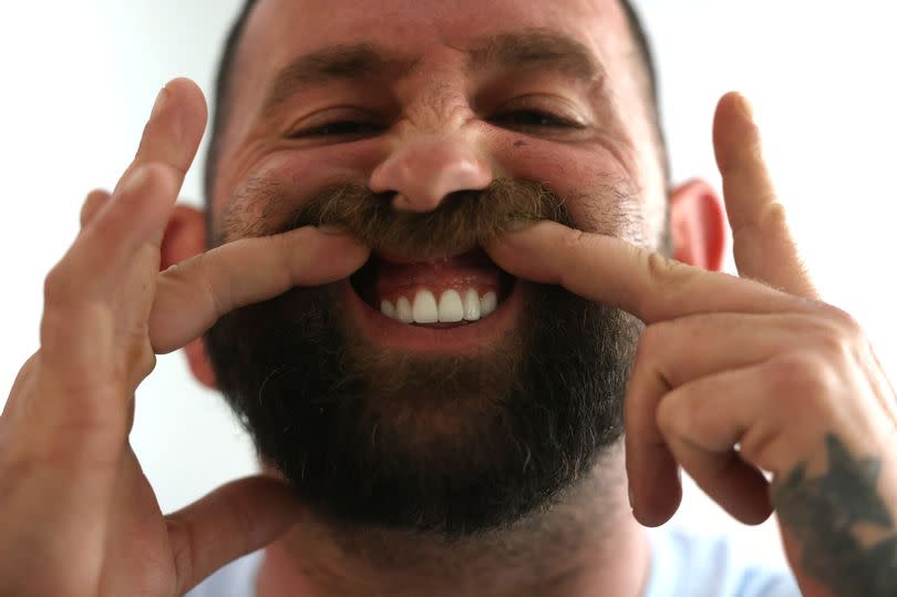 Matthew Bowen is unhappy at the way saliva collects between his gums and his new teeth