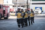 The White Helmets exercise outside the firehouse.
