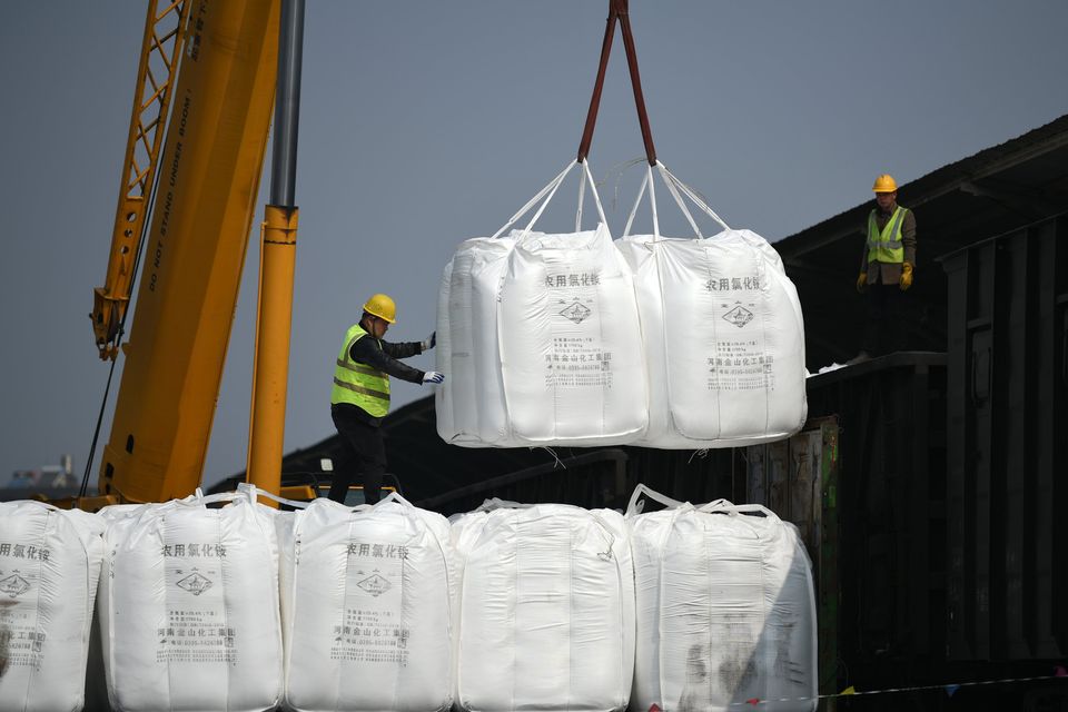 A crane is unloading fertilizer from a cargo train onto a truck at the freight yard of Southern Railway Xiangtangxi Station in Nanchang, Jiangxi province, China, March 7, 2024. (Photo: CFOTO/Future Publishing via Getty Images)