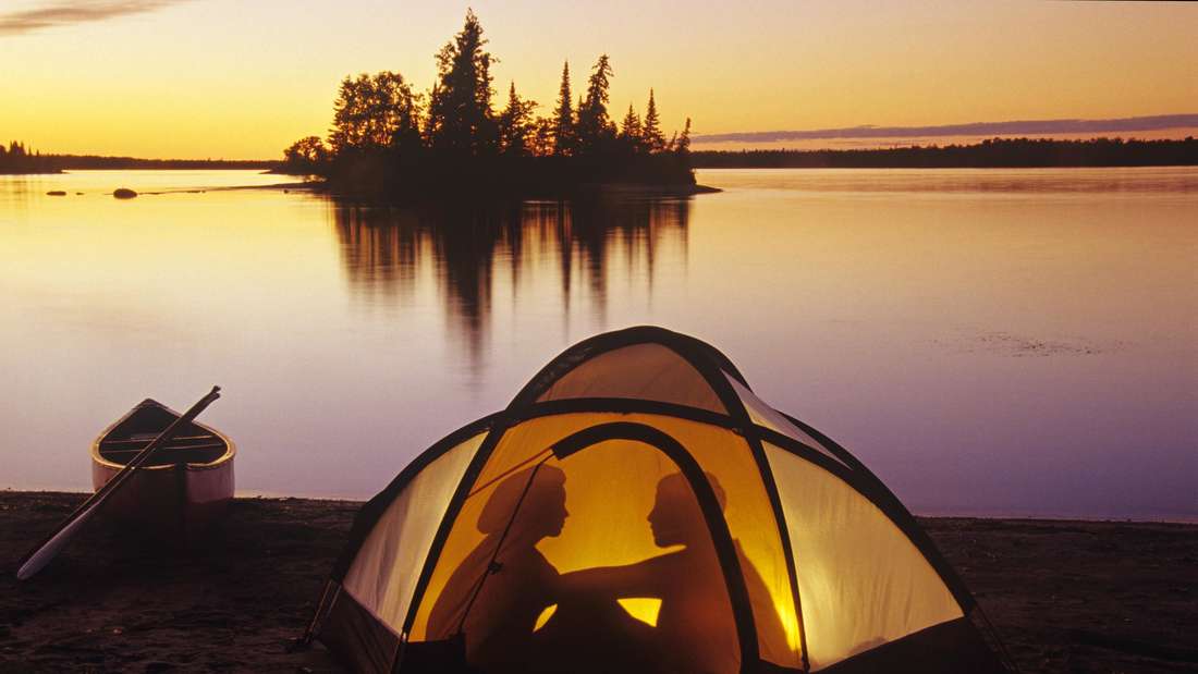 couple camping at Otter Falls, Whiteshell Provincial Park, Manitoba, Canada (MR) MR_acp06927a, MR_acp06927b PUBLICATIONx