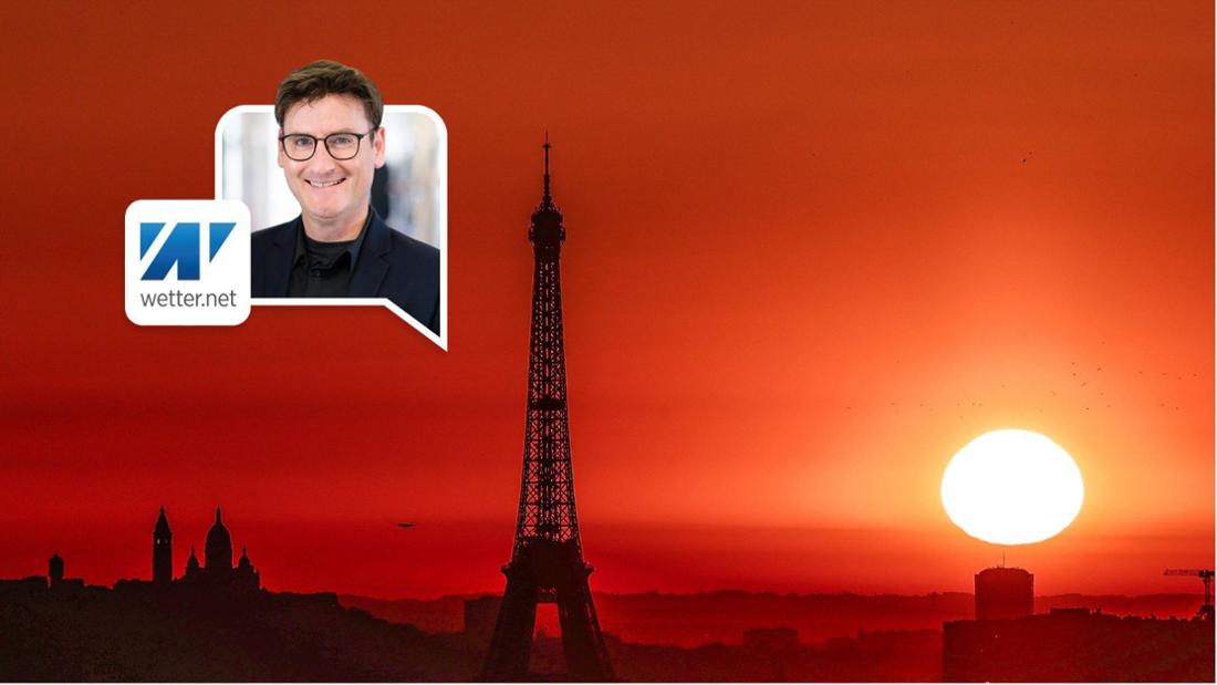 Die Sonne geht über dem Eiffelturm und der Basilika Sacre Coeur auf dem Montmartre-Hügel auf, während in der Stadt wegen der hohen Temperaturen Alarmstufe Rot herrscht