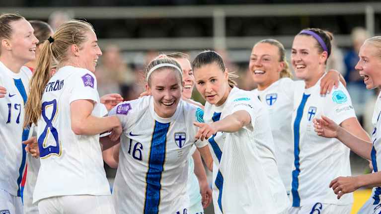 Finland celebrate a goal against Serbia.