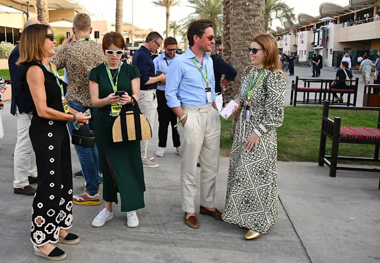 Princess Eugenie, Edo Mapelli Mozzi and Princess Beatrice standing outside at the F1 Grand Prix in Bahrain