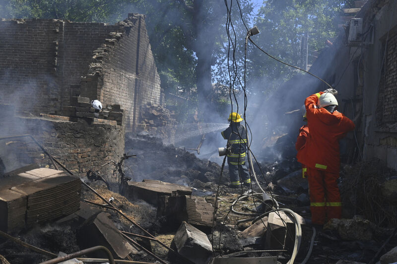 Emergency services personnel work to extinguish a fire following a Russian attack in Odesa, Ukraine, this month. Picture: Michael Shtekel/AP