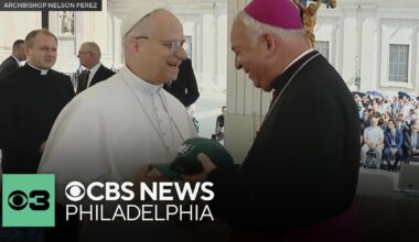 Pope Leo XIV receives an Eagles Super Bowl hat from Archbishop Nelson Pérez during meeting
