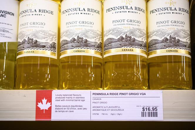 Bottles of Canadian wine, marked with a maple leaf, on a shelf at a store in Toronto (Ontario), Canada, on March 15, 2025.