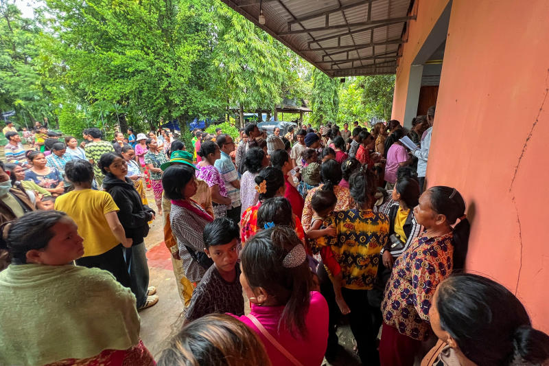 People gather to receive supplies donated at a temporary shelter, after the leaders of Cambodia and Thailand agreed to a ceasefire on Monday effective midnight, in a bid to bring an end to their deadliest conflict in more than a decade after five days of fighting in Srei Snam district, in Siem Reap province, Cambodia, on Monday. (Photo: Reuters)