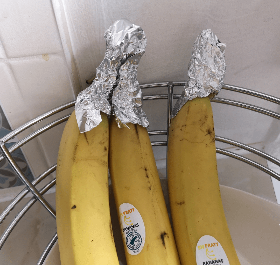 Wife saw a tip on web that wrapping ends of bananas slow down the ripening. Now our bananas has foil conspiracy theorist hats.