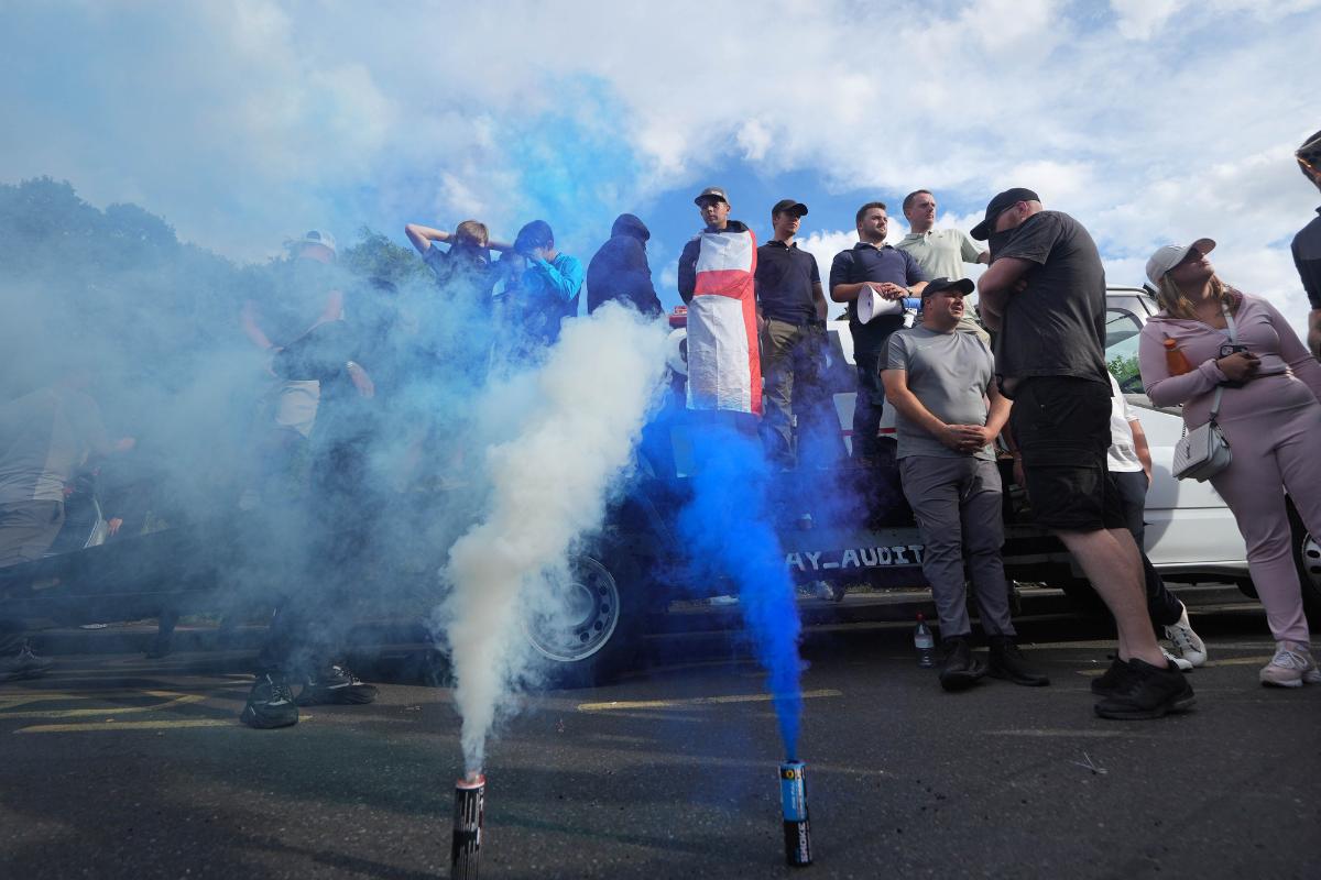 Protesters outside the Bell Hotel in Epping, Essex- today <i>(Image: Yui Mok/PA Wire)</i>