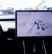 FILE PHOTO: A Tesla Model 3 vehicle drives using FSD (Full Self-Driving) in Encinitas, California, U.S., October 18, 2023. REUTERS/Mike Blake/File Photo