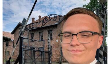 Republican candidate for Governor of California Kyle Langford poses in front of Nazi concentration camp and suggests he will send unemployed & homeless there to be incinerated