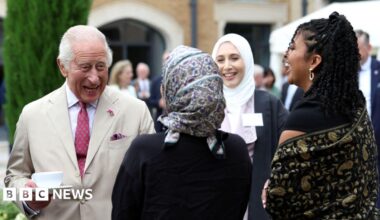 King Charles meets staff during a visit to the Oxford Centre for Islamic Studies in Oxford.