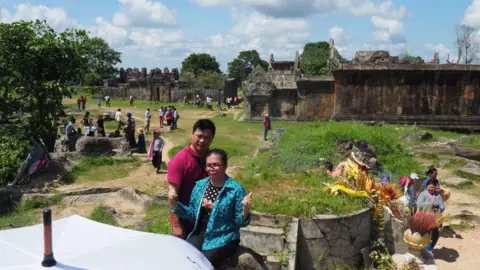 Getty Images Tourists posing for photos at Preah Vihear temple